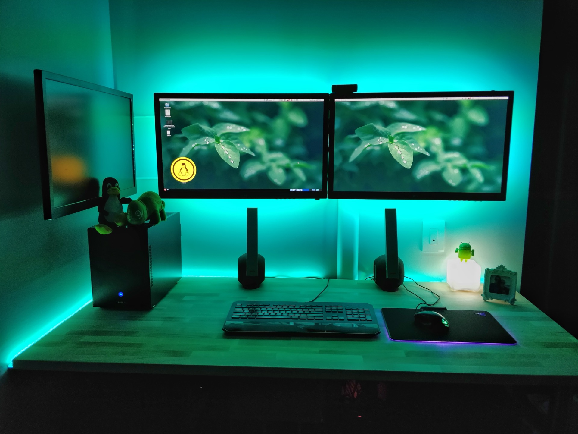 Desk lighting setup with bias lighting behind monitors
