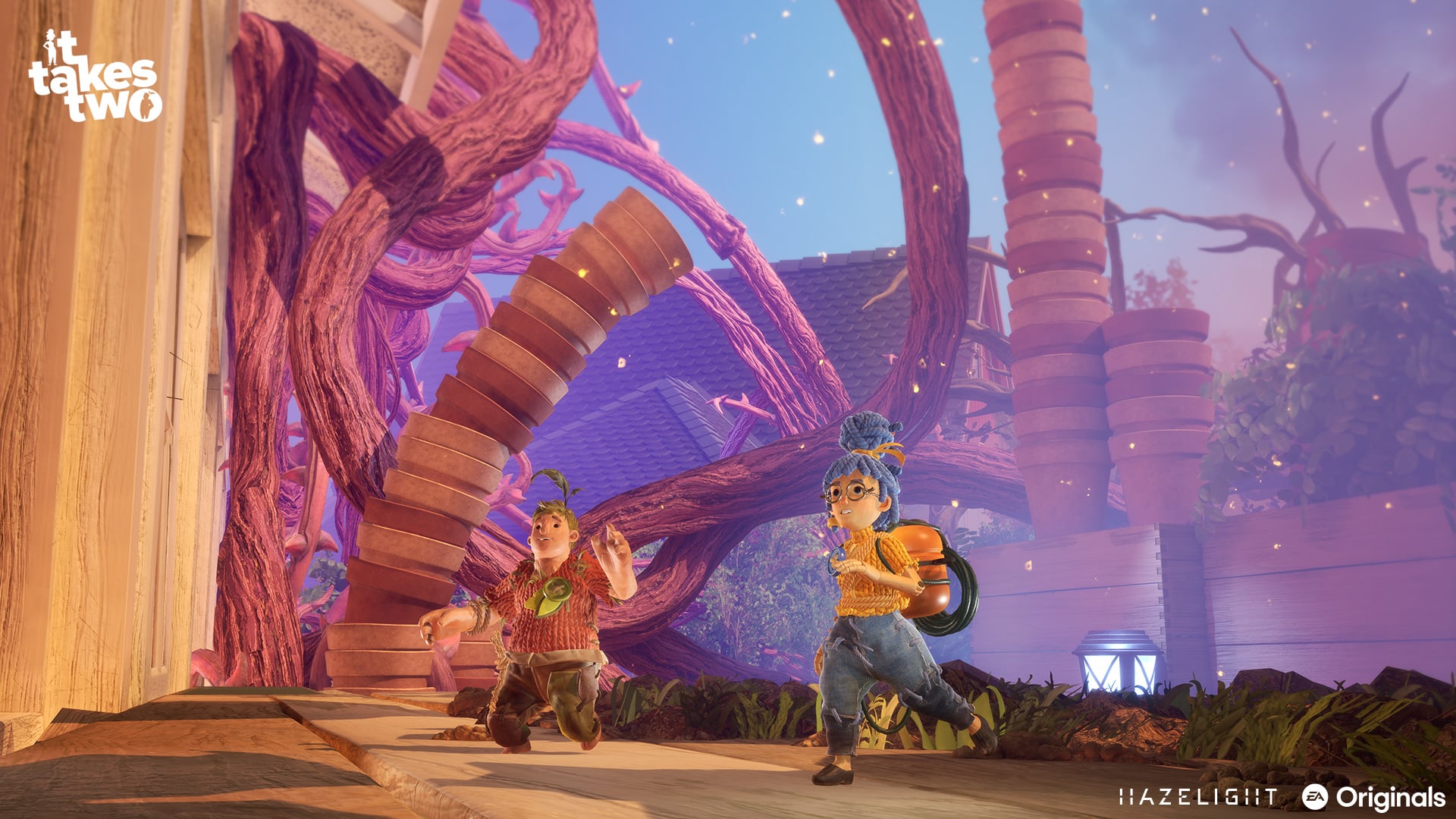 It Takes Two gameplay screenshot showing both player characters working together in a colorful environment