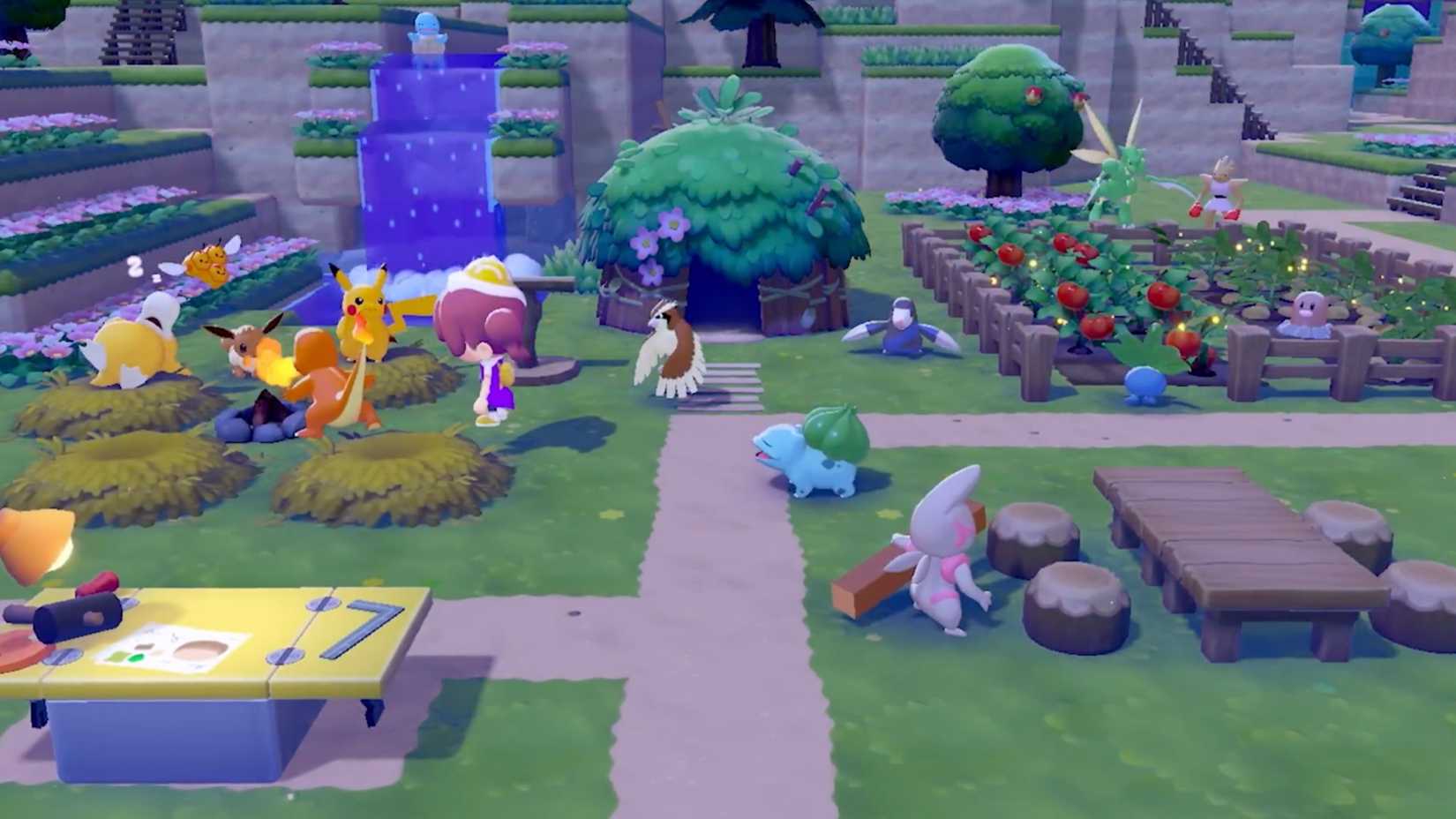 Pokemon Pokopia island with multiple habitat types including grass patches, gardens, workbench, and Pokemon walking around