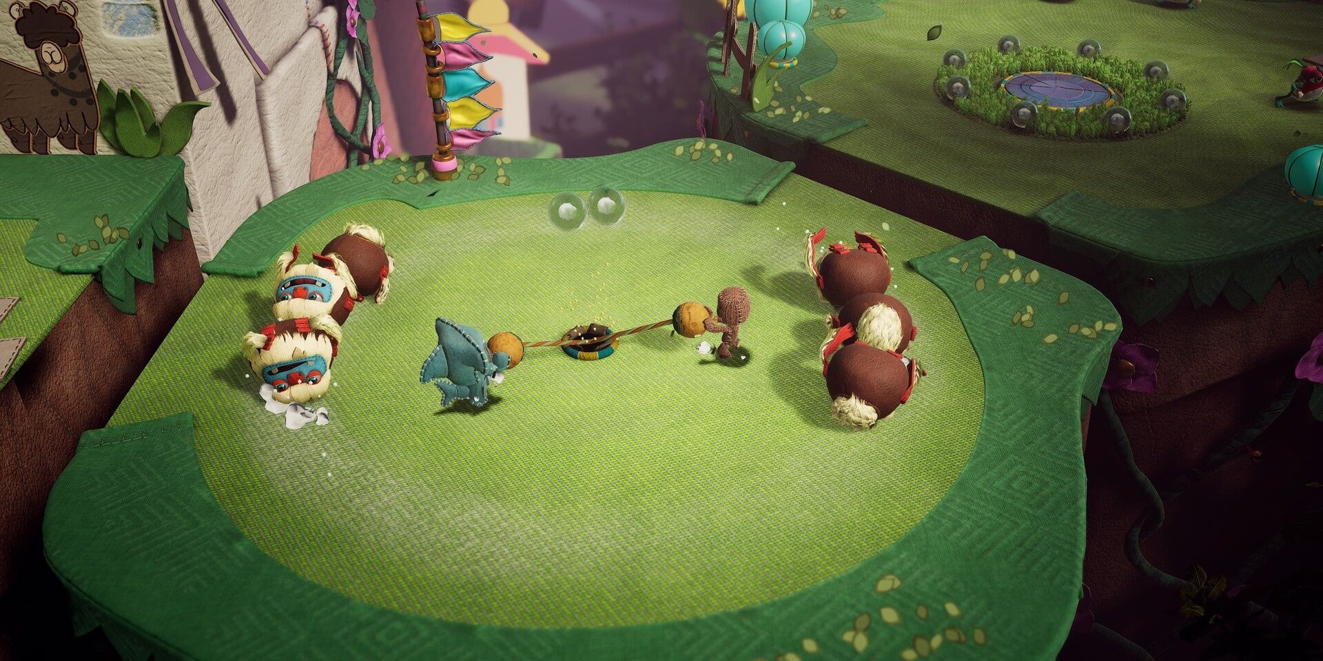 Sackboy A Big Adventure co-op gameplay showing multiple Sackboy characters in a colorful craft-themed level