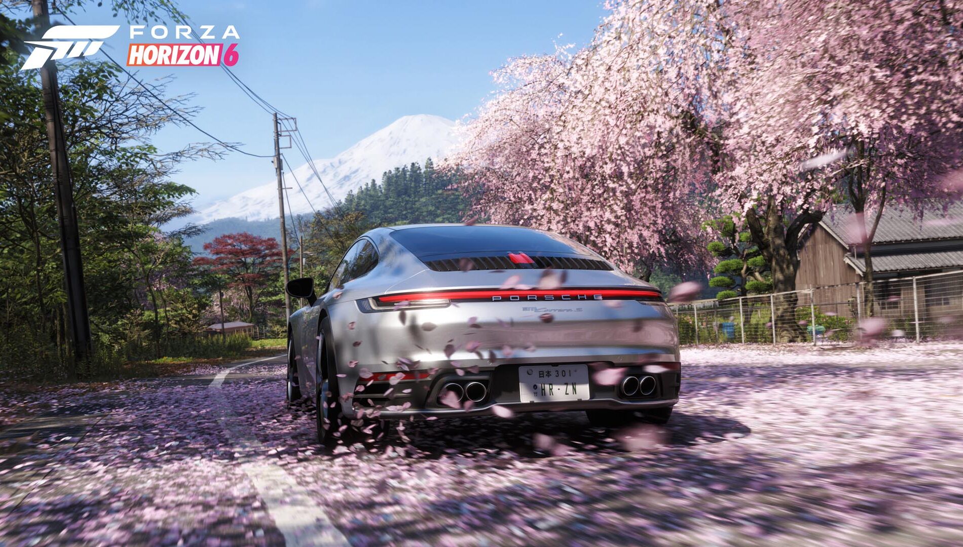Forza Horizon 6 sports car driving past Mount Fuji while exploring the open world to earn credits