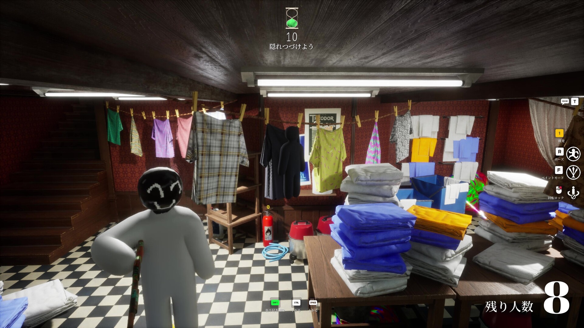 MECCHA CHAMELEON player with a painted face standing in a laundry room as hiders blend into the linens